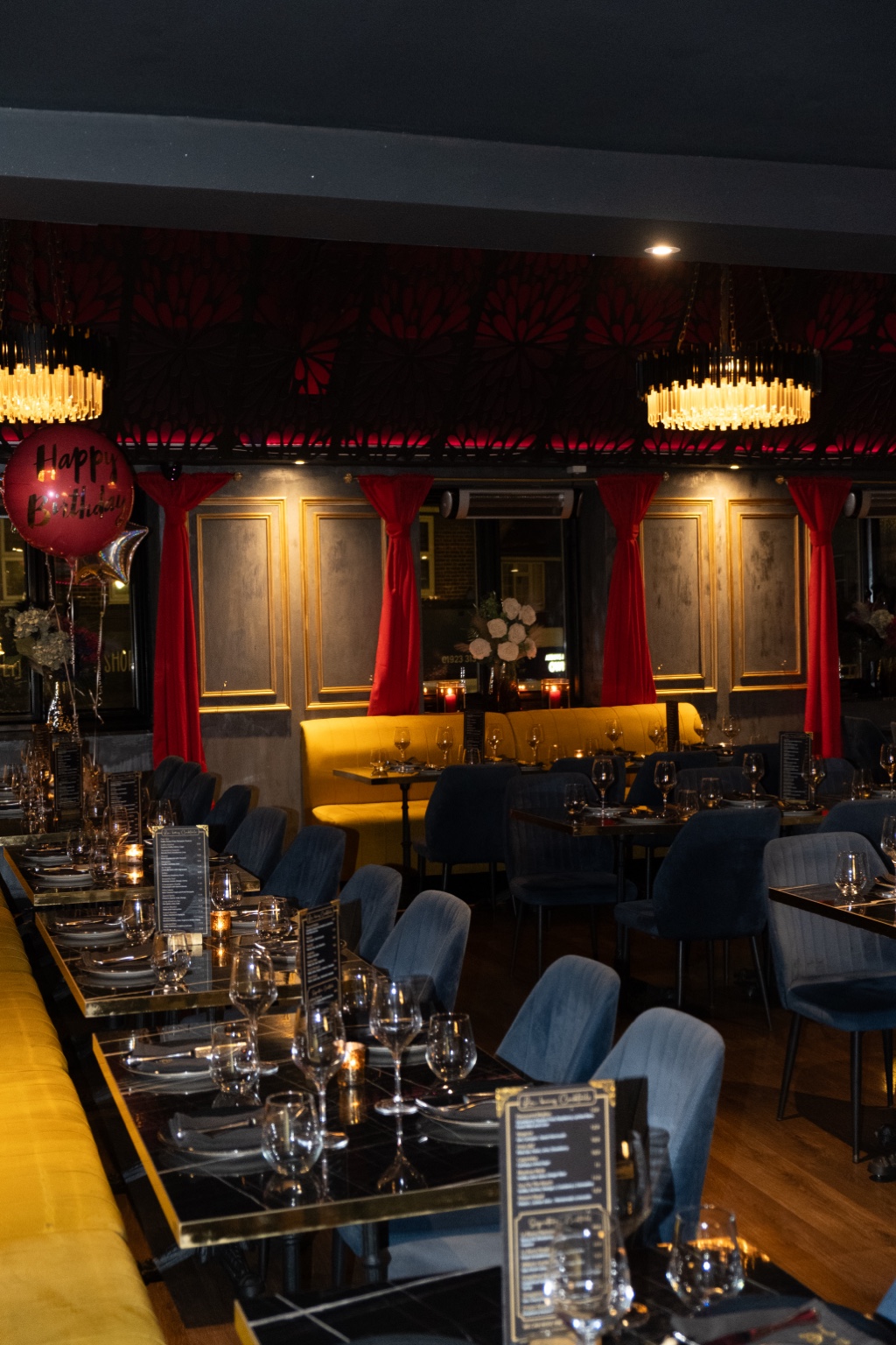Elegant restaurant interior with warm lighting and dressed tables